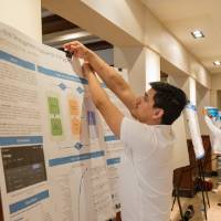 Gautam setting up his research poster